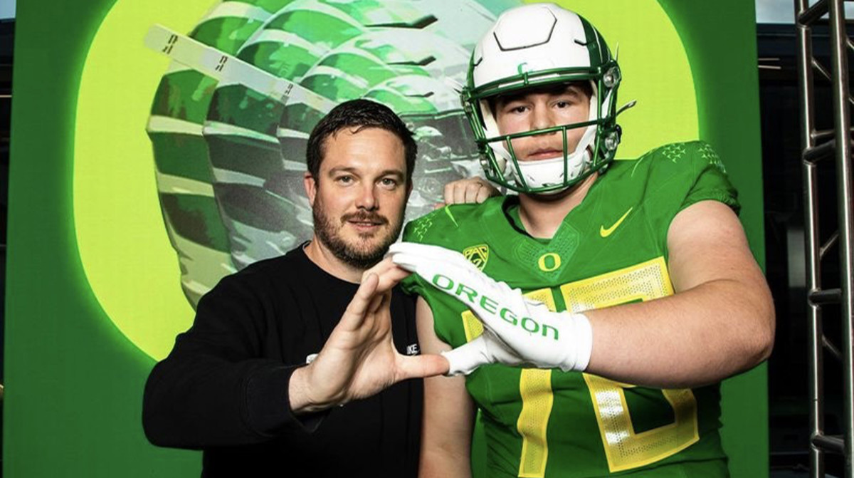 Trent Ferguson poses with Dan Lanning.